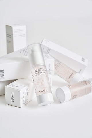 Cosmetic products with visible branding on a light background