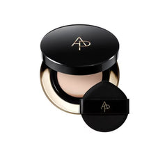 Makeup compact with black lid and round applicator on a white background