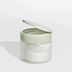 Skincare product container with lid open on a white background