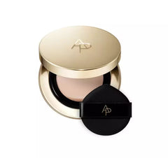 Makeup compact with gold lid and black case on a white background