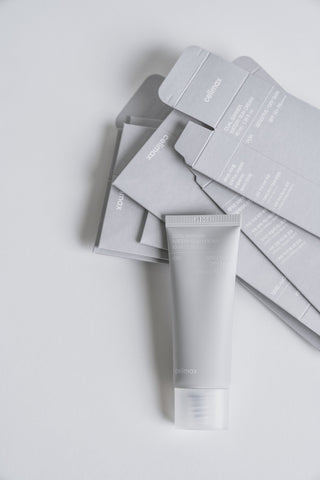 Skincare product with packaging on a light gray background