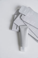 Skincare product with packaging on a light gray background