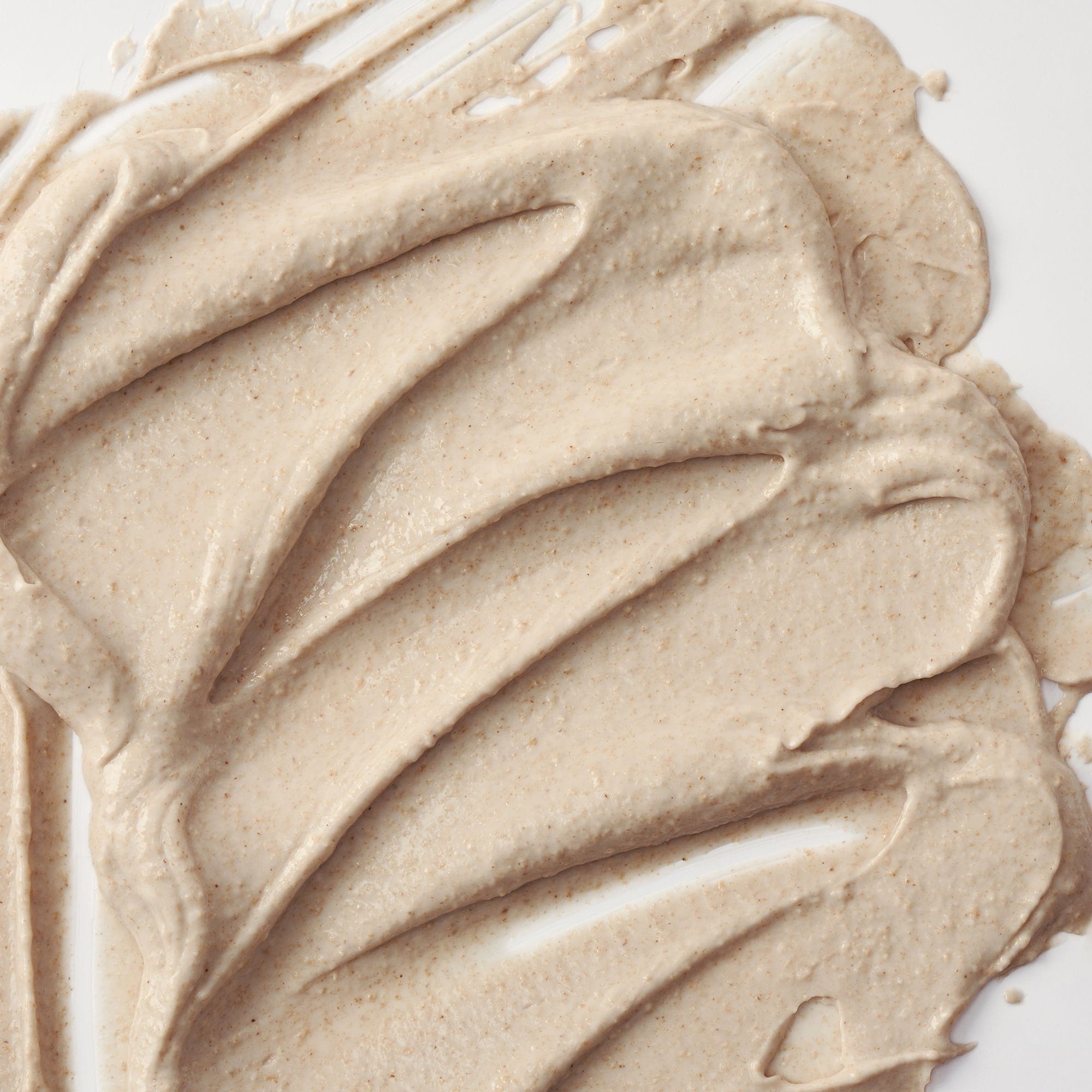Close-up of beige cream swatch on a white background
